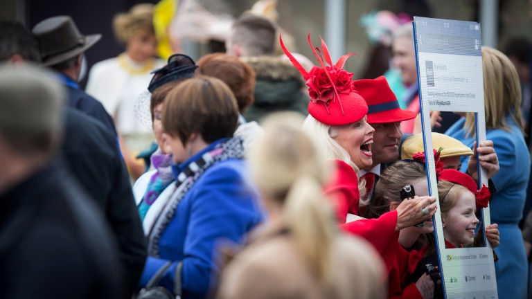 A family in matching colours pose for an Instagram photo at Fairyhouse in April