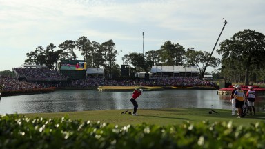 Jason Day plays a shot into the iconic 17th