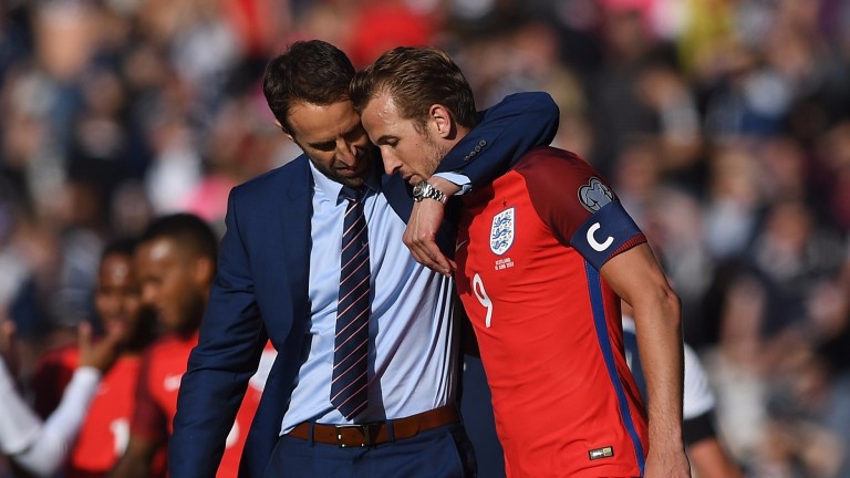 England manager Gareth Southgate embraces skipper Harry Kane