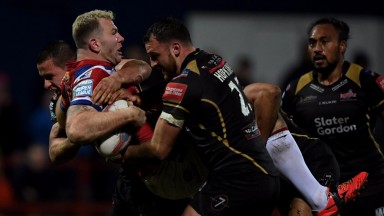 Leigh's Sam Hopkins gets stuck into Keegan Hirst of Wakefield