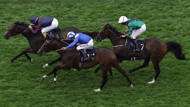 Tom Queally riding The Tin Man leads the Diamond Jubilee Stakes