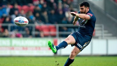 Matty Smith of St Helens unleashes one of his trademark kicks