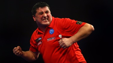 Mensur Suljovic celebrates at the World Darts Championship