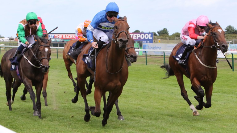 Millie's Kiss (blue cap), running in the name of stablemate Mandarin Princess, wins the opener at Yarmouth from 4-6 favourite Fyre Cay