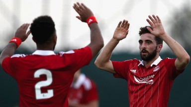 Graeme Shinnie celebrates scoring for Aberdeen