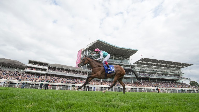 Frankie Dettori celebrates as Enable passes the line in splendid isolation