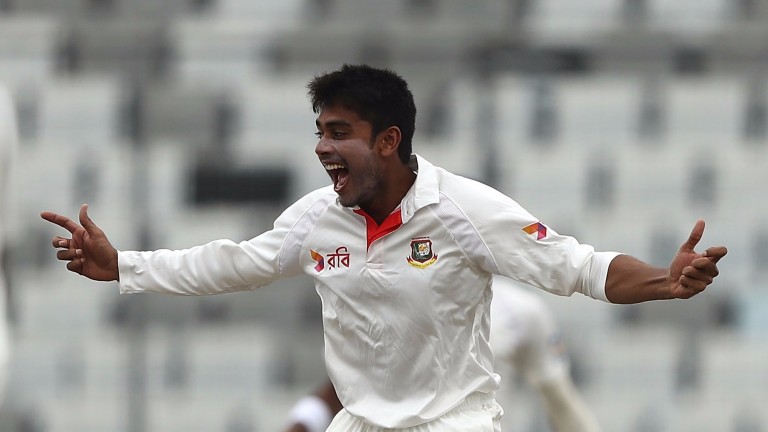 Mehedi Hasan celebrates the wicket of Matthew Wade in the first Test