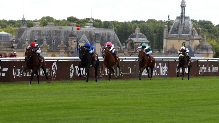 Cracksman (red hat) winning the Prix Niel under Frankie Dettori