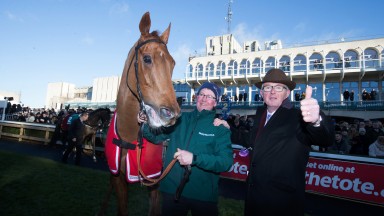Simply smashing: owner David Robinson gives the thumbs-up after the stewards reverse the result in the Paddy's Rewards Club Chase in favour of his Simply Ned