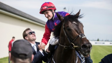 Romanised and Shane Foley are greeted by winning trainer Ken Condon after landing the Tattersalls Irish 2,000 Guineas