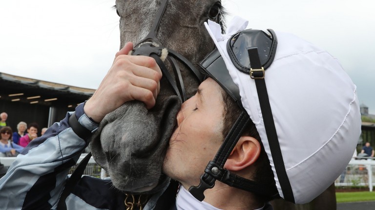 Colm O'Donoghue embracing Alpha Centauri in the winner's enclosure