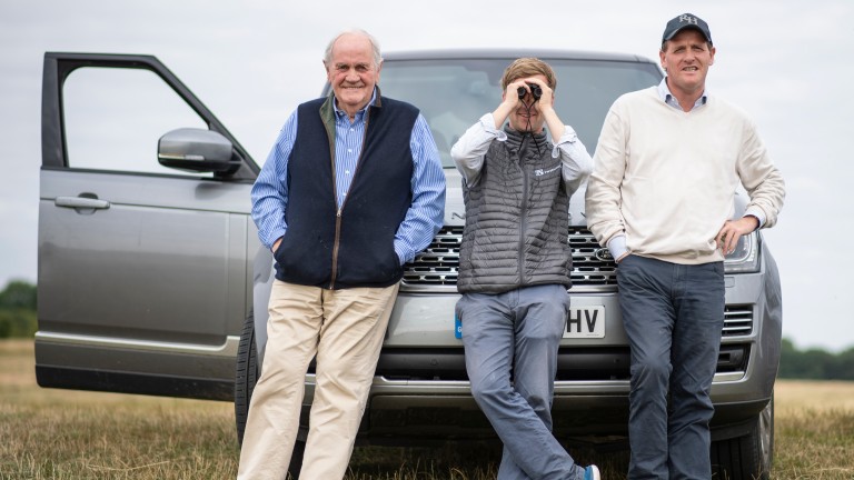 Assistant trainer Tom Ward is flanked by two generations of Hannons, Richard snr and Richard jnr, on the gallops