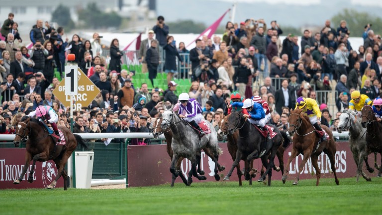 James Doyle (yellow and purple cap) tries to reel in Enable on Sea Of Class