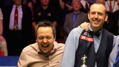 Lee Walker (left) helps good friend Mark Williams celebrate his world title triumph in May