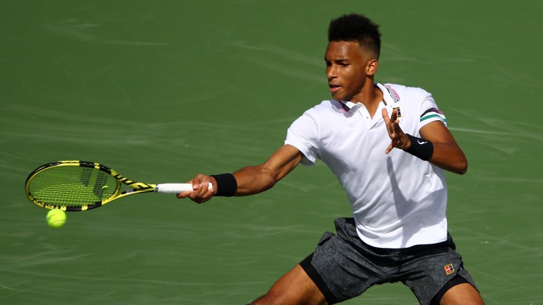 Wild-card Felix Auger-Aliassime has beaten Cameron Norrie and Stefanos Tsitsipas in straight sets
