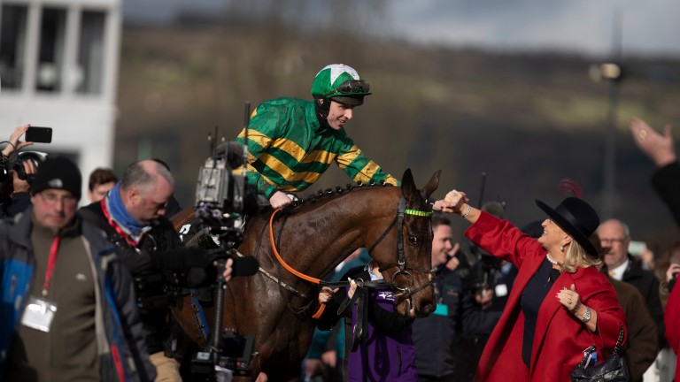 Mark Walsh is congratulated by Noreen McManus, wife of winning owner JP as they return to the winner's enclosure