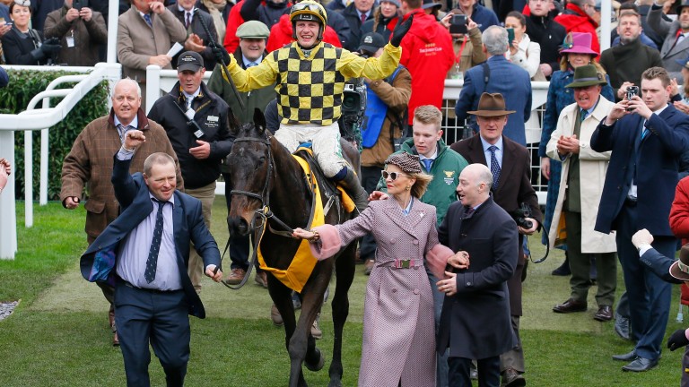 Al Boum Photo and Paul Townend are led into the winner's enclosure after winning the Gold Cup