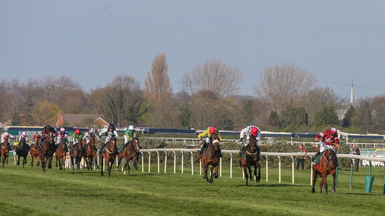 Tiger Roll clears away from Magic Of Light and Rathvinden in the Grand National