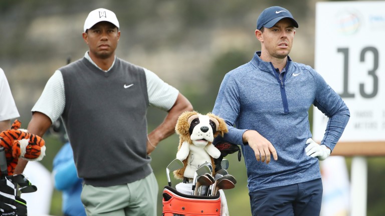 Rory McIlroy (right) can avenge his recent Match Play defeat to Tiger Woods (left)
