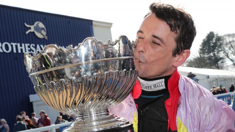 Sean Quinlan: posing with the Scottish Grand National trophy