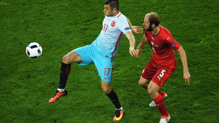 Burak Yilmaz (left) has been in red-hot form for Besiktas