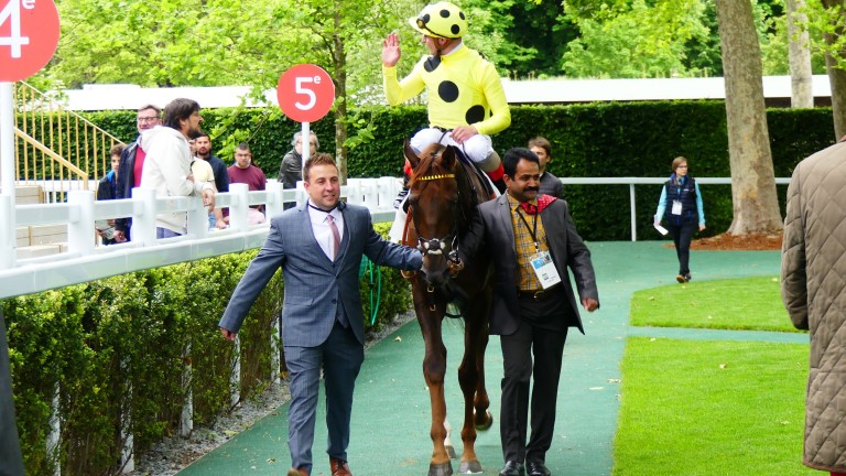 Zabeel Prince and Andrea Atzeni return to the Longchamp winner's enclosure after scoring in the Group 1 Prix d'Ispahan
