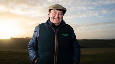 Blue-sky thinking: Nicky Henderson in buoyant mood on top of the downs at Seven Barrows