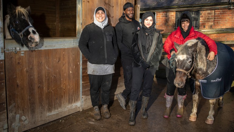 Freedom Zampaladus with his assistant Salwa Tebai and students Saarah Nazir and Shareefa