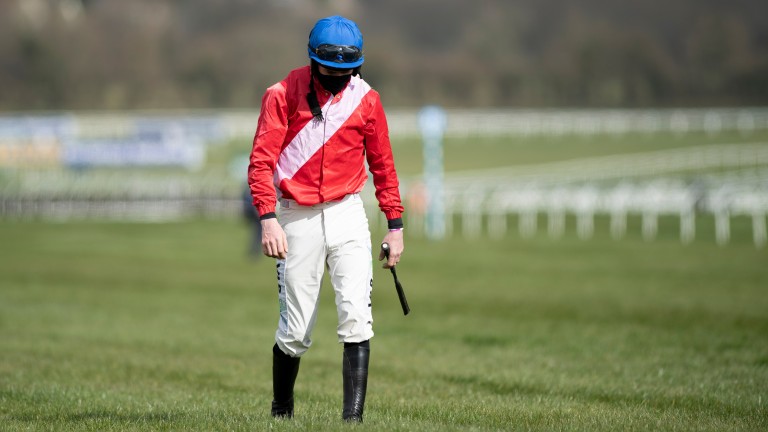 Jack Kennedy walks back after falling from Envoi Allen in the Marsh Novices' Chase