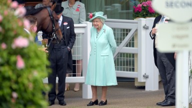 ASCOT, ENGLAND - JUNE 19: Queen Elizabeth II watches as horses are led into the parade ring during Royal Ascot 2021 at Ascot Racecourse on June 19, 2021 in Ascot, England. (Photo by Antony Jones/Getty Images for Royal Ascot)