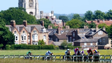 BEVERLEY, ENGLAND - JUNE 22: A general view of the runners and riders in action as they compete in the Clearanswer Call Centres Handicap at Beverley racecourse on June 22, 2021 in Beverley, England. (Photo by Tim Goode-Pool/Getty Images)