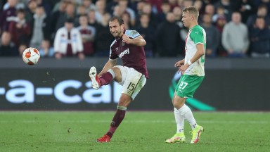 West Ham United's Craig Dawson and Rapid Vienna's Marco Grull in action