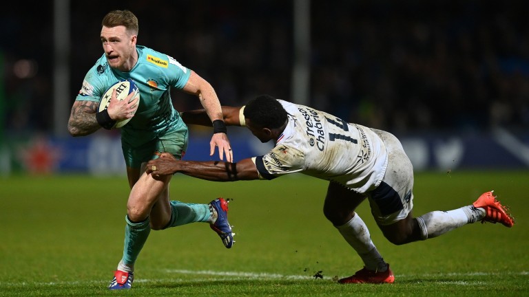 Stuart Hogg tries to slip a tackle in Exeter's Champions Cup win over Montpellier