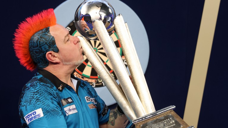 Peter Wright celebrates his 7-5 victory over Michael Smith in the 2022 William Hill World Championship final