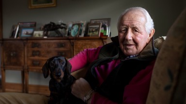 Recently retired David Elsworth poses with "Stretch"the Dachshund at his home in Newmarket3.1.21 Pic: Edward Whitaker