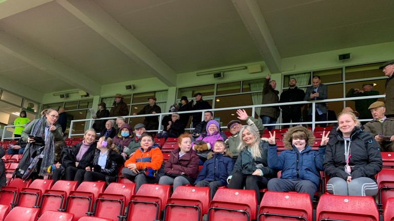 A crowd of young racegoers enjoy the Autism in Racing day at Haydock last year