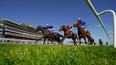 NEWBURY, ENGLAND - MAY 14: Jim Crowley riding Israr (L, blue) win The BetVictor London Gold Cup Handicap at Newbury Racecourse on May 14, 2022 in Newbury, England. (Photo by Alan Crowhurst/Getty Images)