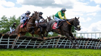 Unanswered (yellow sleeves) breaks his duck over hurdles at Punchestown