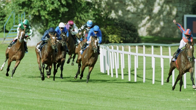 The field ignores Ballydoyle pacemaker Ice Dancer (right) as Frankie Dettori (blue cap) slips up the inside of fellow Godolphin runner Give The Slip