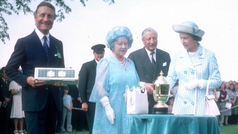 Grundy's owner Dr Carlo Vittadini receives the King George VI and Queen Elizabeth Stakes trophy from the Queen and the Queen Mother at Ascot in 1975