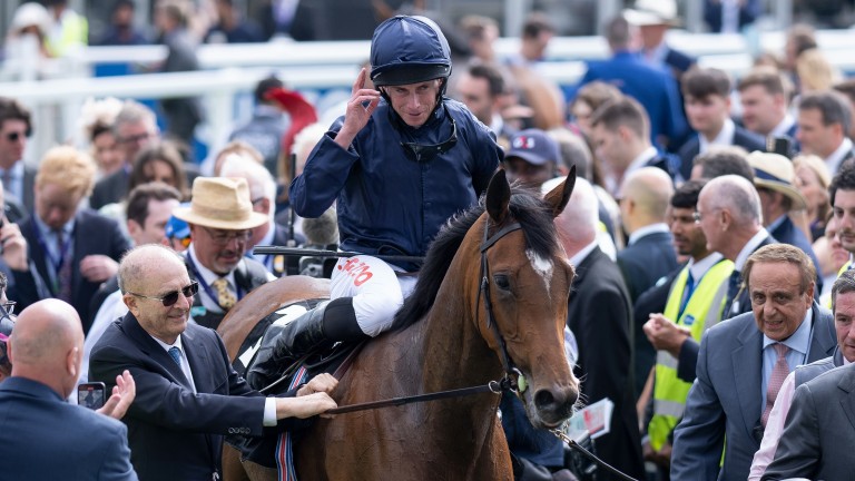 Tuesday and Ryan Moore are led in after winning the Oaks