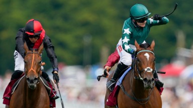 CHICHESTER, ENGLAND - JULY 28: Hollie Doyle riding Nashwa (green) win The Qatar Nassau Stakes during day three of the Qatar Goodwood Festival at Goodwood Racecourse on July 28, 2022 in Chichester, England. (Photo by Alan Crowhurst/Getty Images)