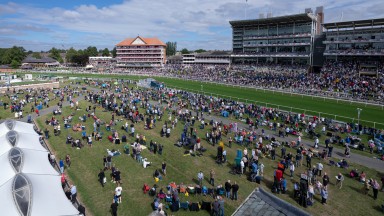 Racegoers gather ahead of the opening race of the Ebor meetingYork 17.8.22 Pic: Edward Whitaker