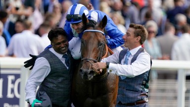 YORK, ENGLAND - AUGUST 17: Stable lads congratulate Jim Crowley after he rides Baaeed to win The Juddmonte International Stakes at York Racecourse on August 17, 2022 in York, England. (Photo by Alan Crowhurst/Getty Images)