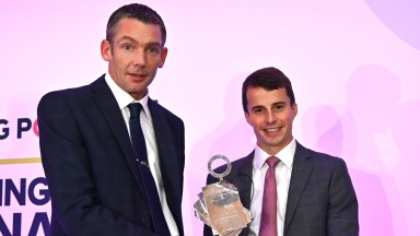 James Maloney (right) of Star Sports receives the Betting Shop Manager of The Year trophy from champion jockey William Buick