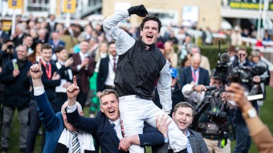Danny Mullins is carried in the winner's enclosure after Flooring Porter's victory in the Stayers' Hurdle
