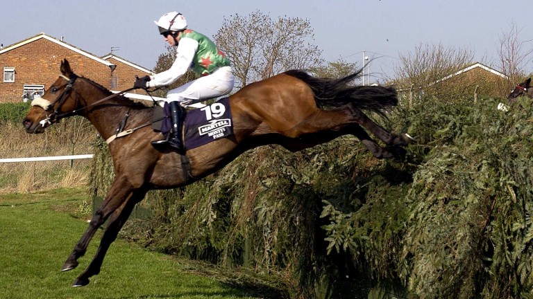 Monty's Pass and Barry Geraghty are clear as they land over Valentine's on the second circuit of the 2003 Grand National